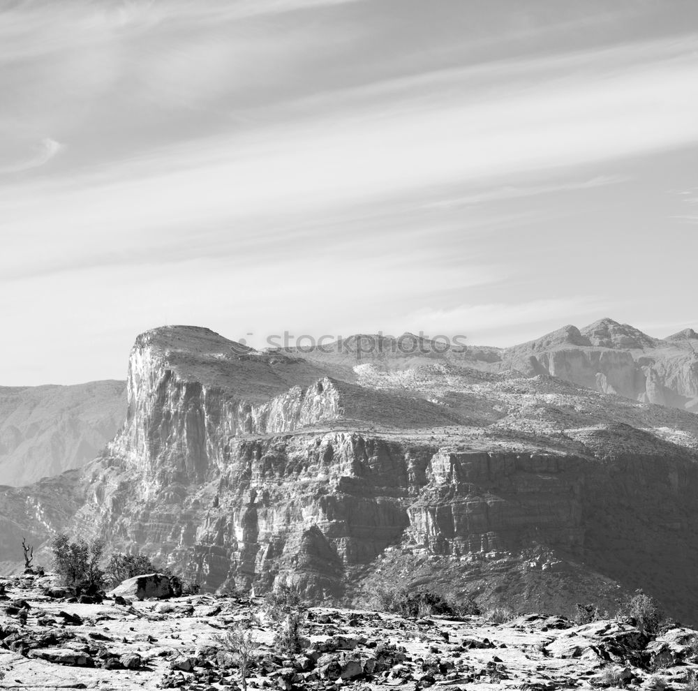 Similar – A vast expanse of fields and mountains full of trees taken from the top of a cliff