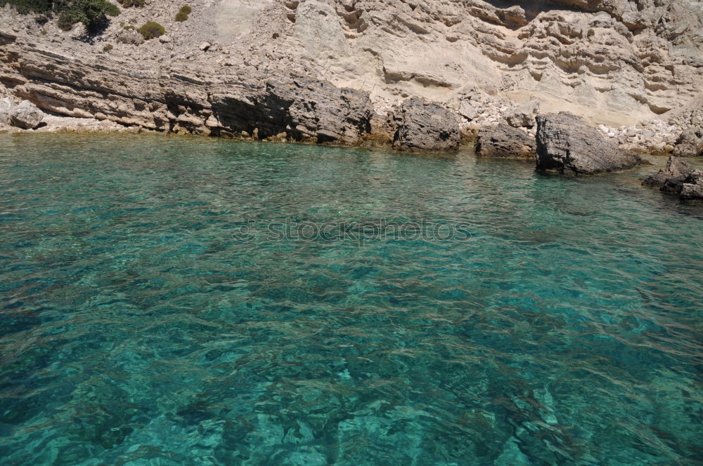 Similar – Urlaub und Erholung. Meer und Felsen. Blick vom Wasser. Idylle