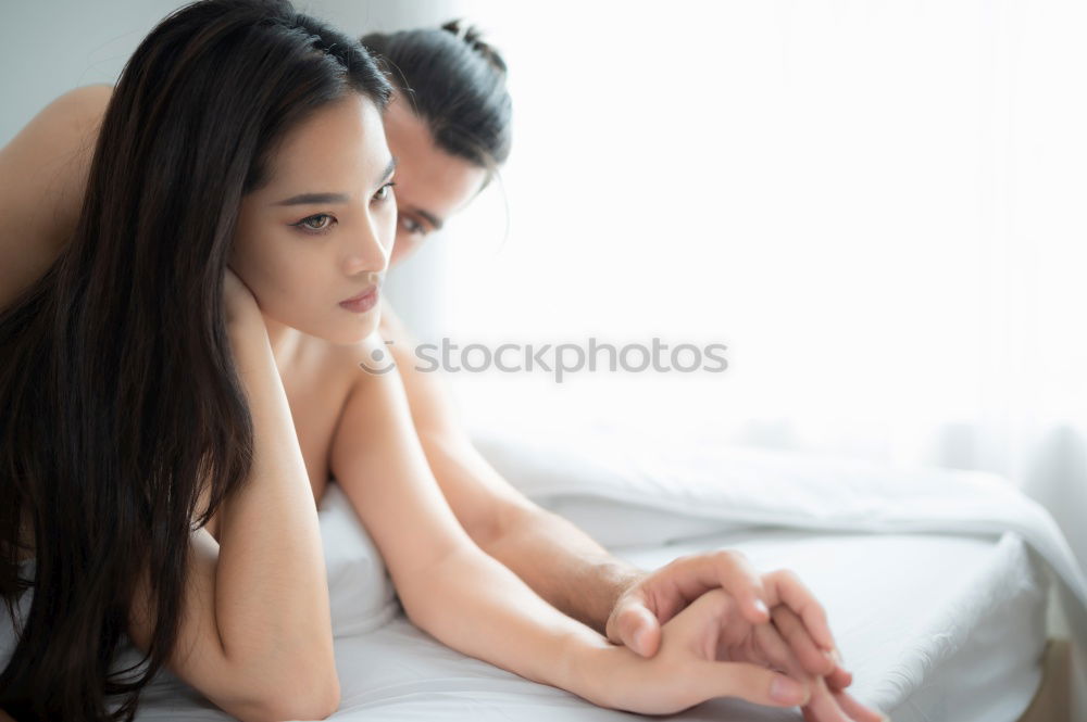 Similar – Image, Stock Photo young, slim, leggy woman sits barefoot in hotpants on the edge of a sofa and lets her long hair fall over her face