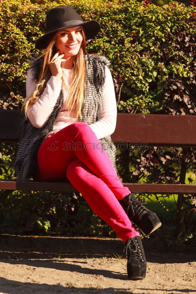 Similar – Woman enjoys sun on park bench