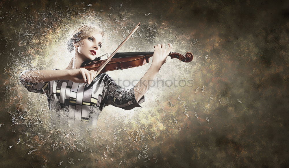 Similar – Pretty young violinist playing the violin