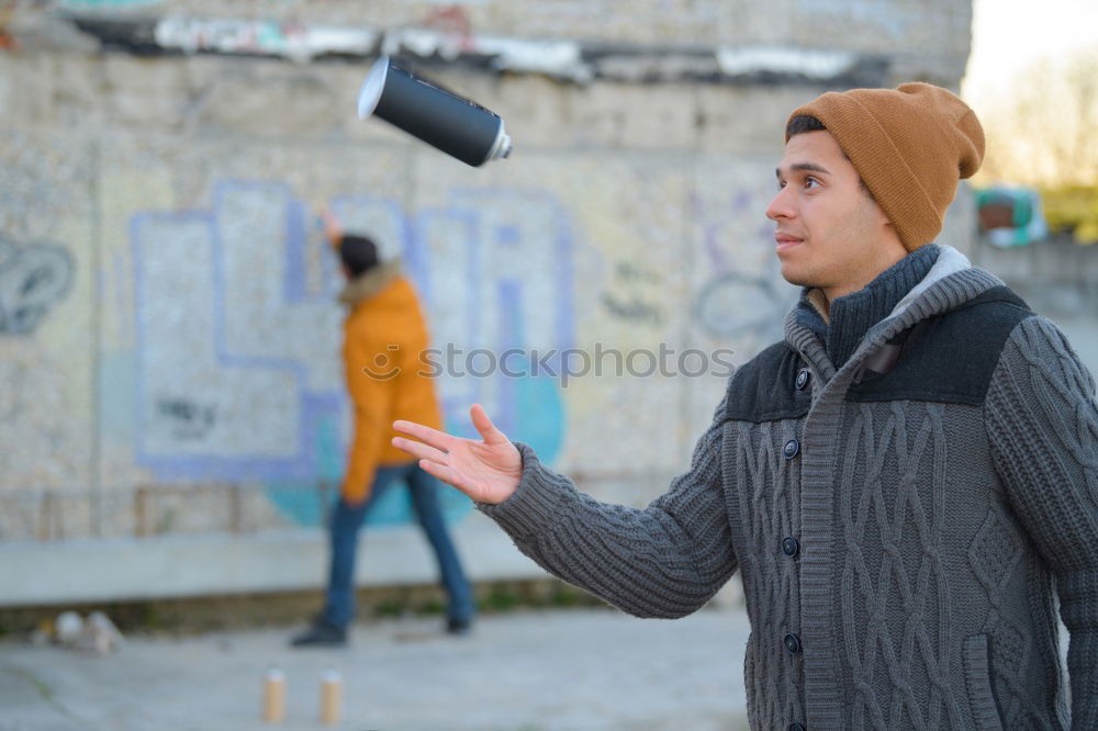 Similar – Young modern man sitting on halfpipe taking picture with Camera