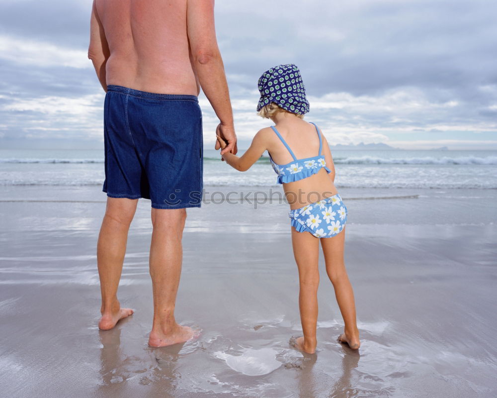 Similar – Image, Stock Photo caucasian mother and son playing with windmill at the beach