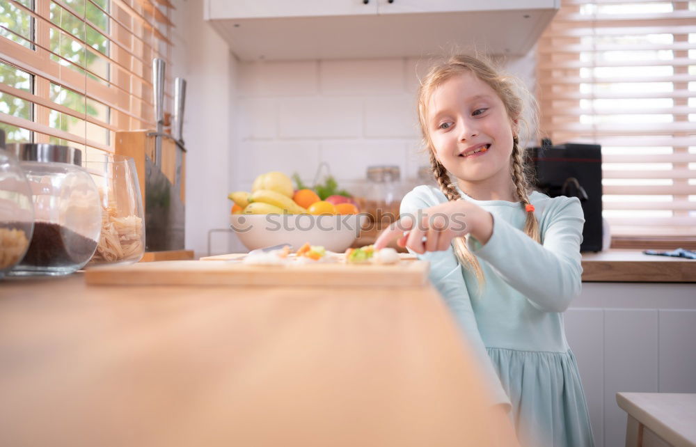 Similar – Image, Stock Photo Portrait of little girl preparing baking cookies.