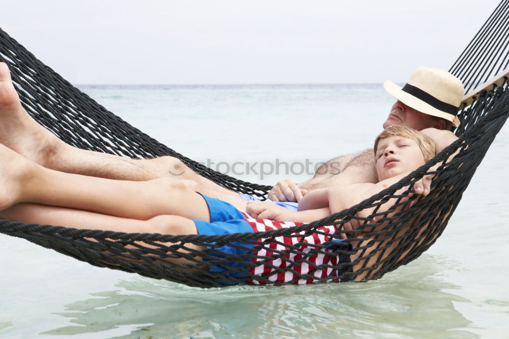 Similar – Image, Stock Photo A young man relaxing on his beach vacation