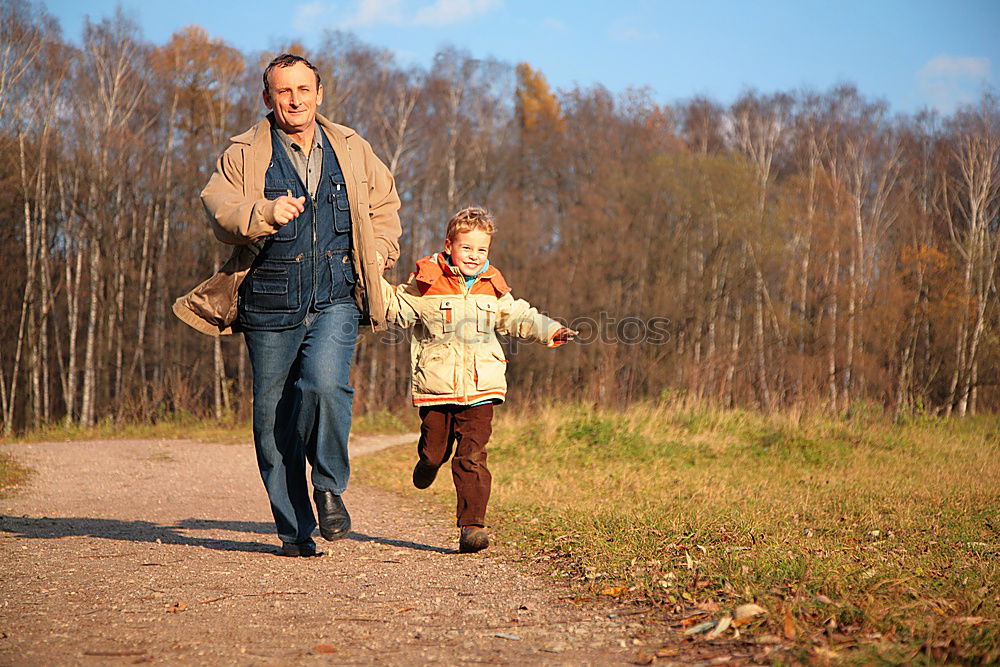 Similar – Image, Stock Photo Happy family walking together holding hands in the forest