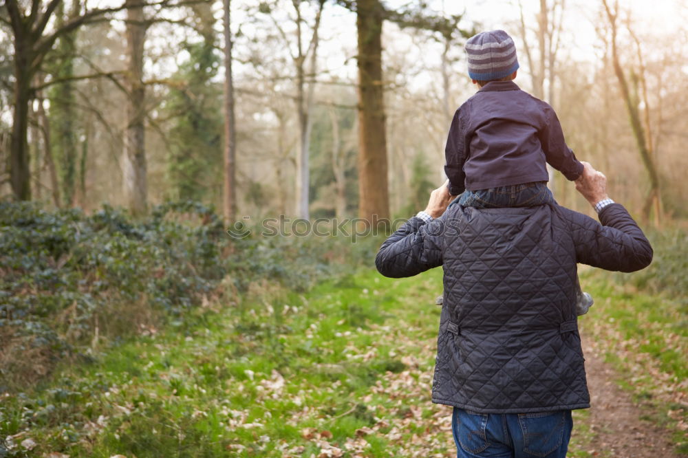 Similar – Father and son playing on the road at the day time.