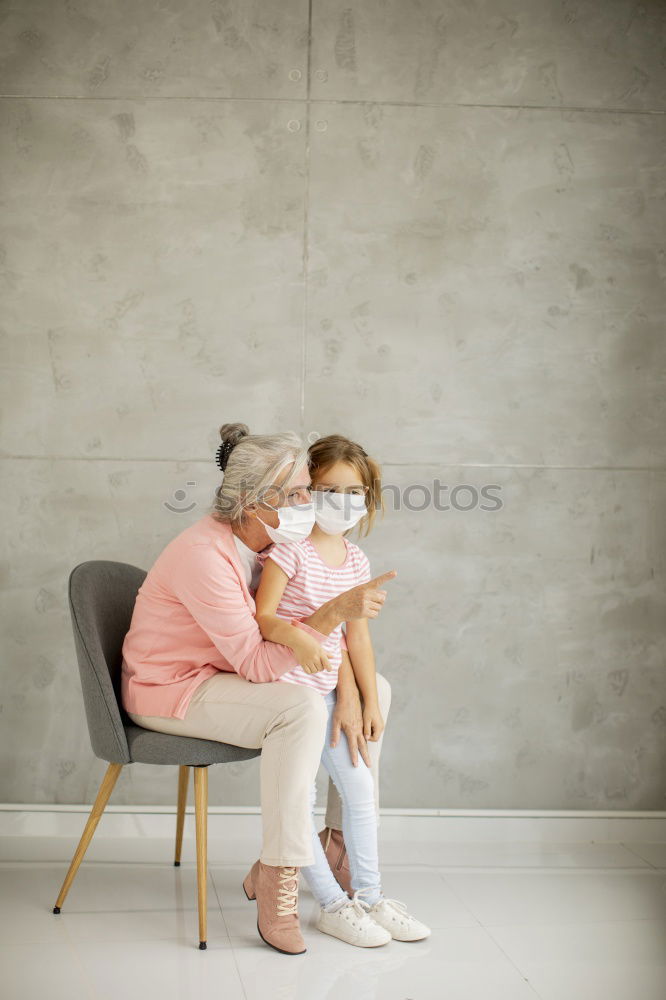 Similar – Baby girl holding finger of senior man hand