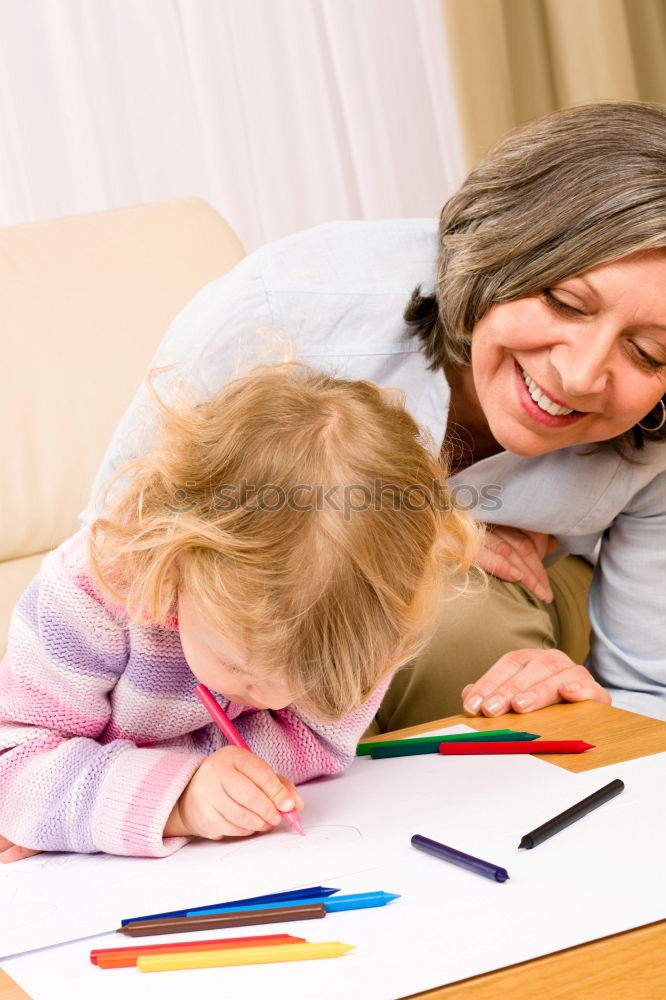 Image, Stock Photo Mom with little daughter drawing the colorful pictures