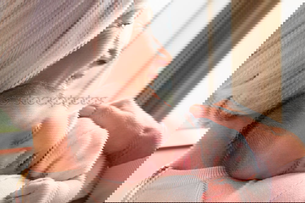 Similar – Image, Stock Photo Newborn lying on bed embraced by her mother