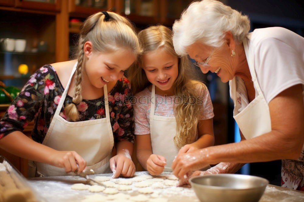 Similar – Image, Stock Photo Little sisters cooking with her mother in the kitchen.