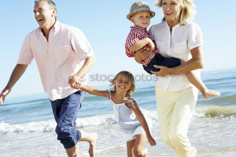 Similar – Father and children playing on the beach at the day time. Concept of friendly family.