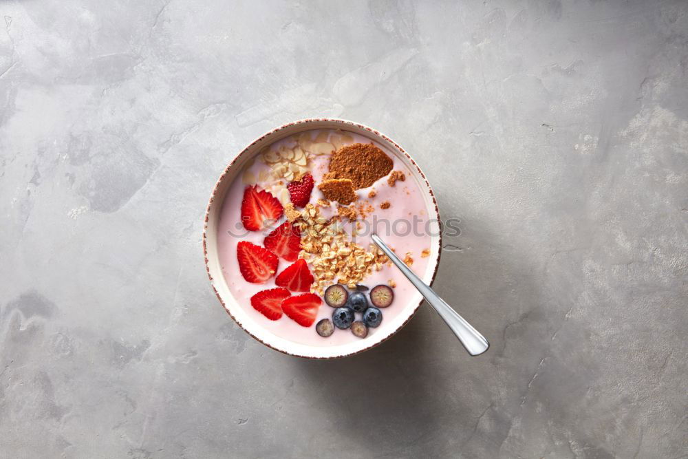 Similar – Image, Stock Photo Smoothie mango bowl with chia seeds yogurt pudding and cranberries, nuts, oatmeal topping in coconut shells with spoon. Healthy clean breakfast food. Copy space for your text or design