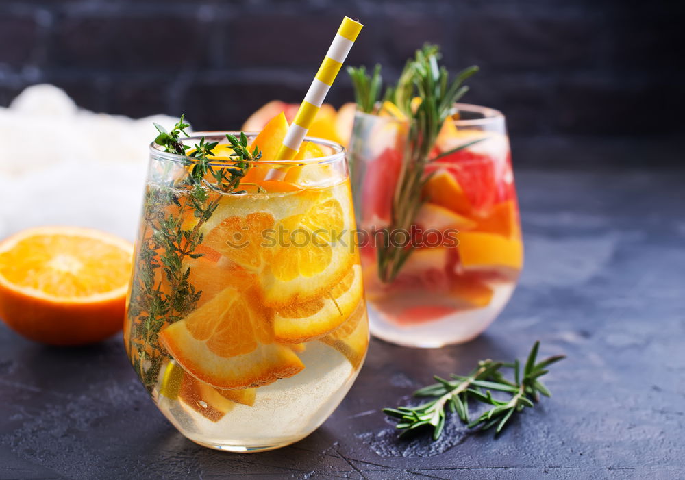 Similar – Two glasses of soft drink with honey- and watermelon, rosemary, ice cubes and drinking straw