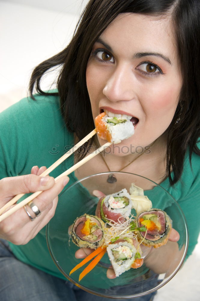 Similar – Crop woman eating sushi