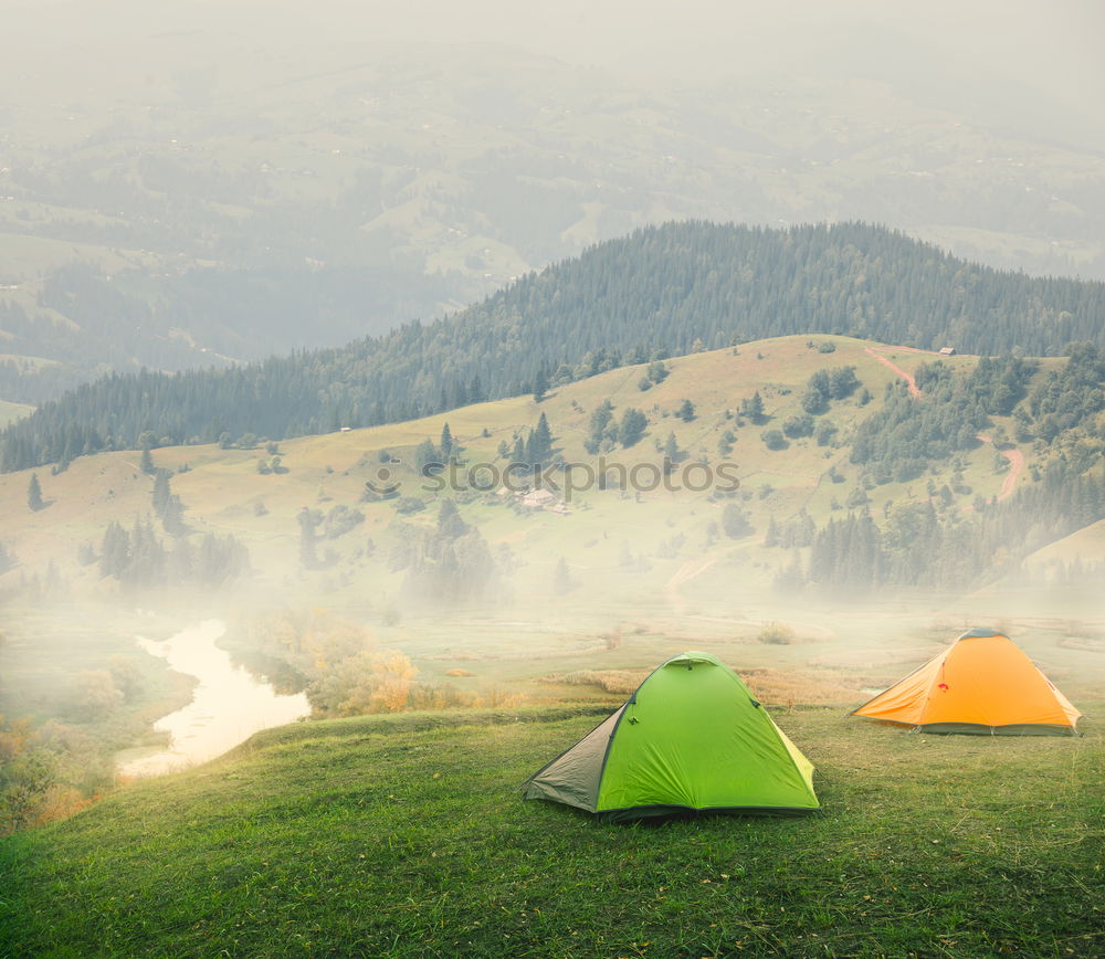 Similar – Image, Stock Photo Young woman near green tent and forest lake