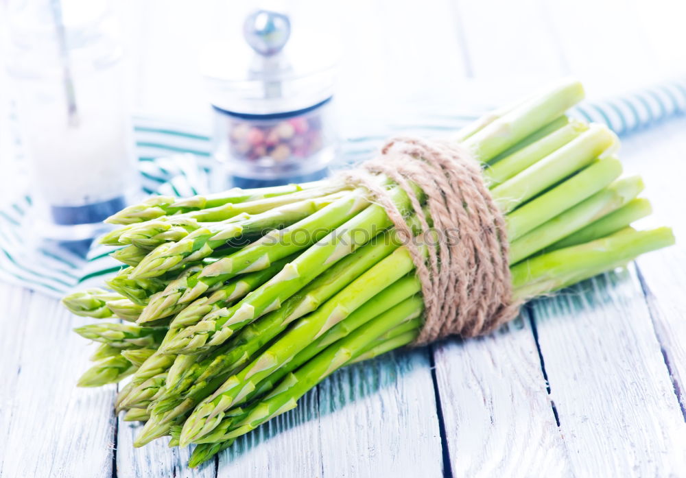 Similar – Image, Stock Photo Fresh raw asparagus spears on a white table