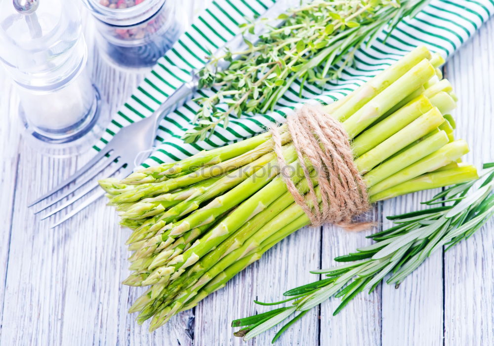 Similar – Image, Stock Photo Fresh raw asparagus spears on a white table