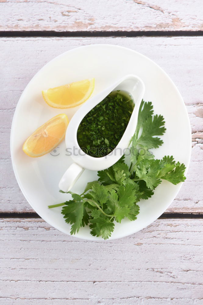 Similar – Image, Stock Photo Green herbs salad with oil in white skin