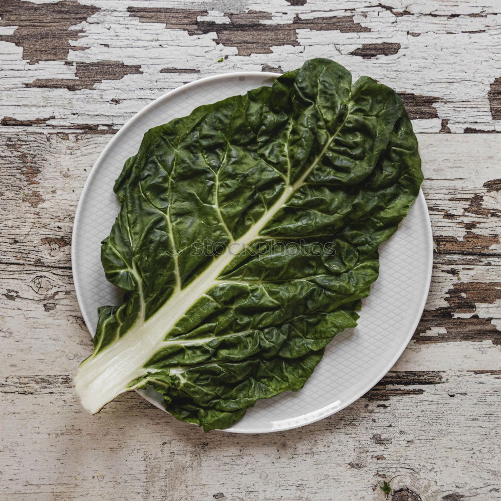 Similar – spinach in a round cast-iron frying pan