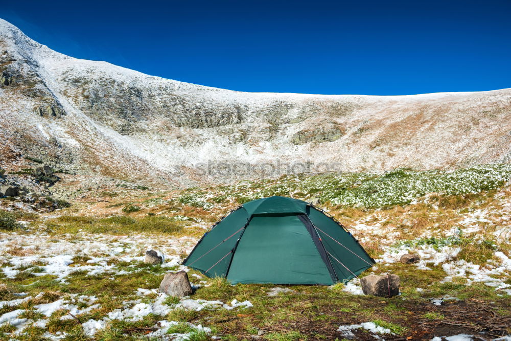 Image, Stock Photo Green tent on the green lawn in snow mountains