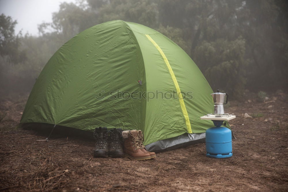 Similar – Tent in storm and rain in an autumn landscape