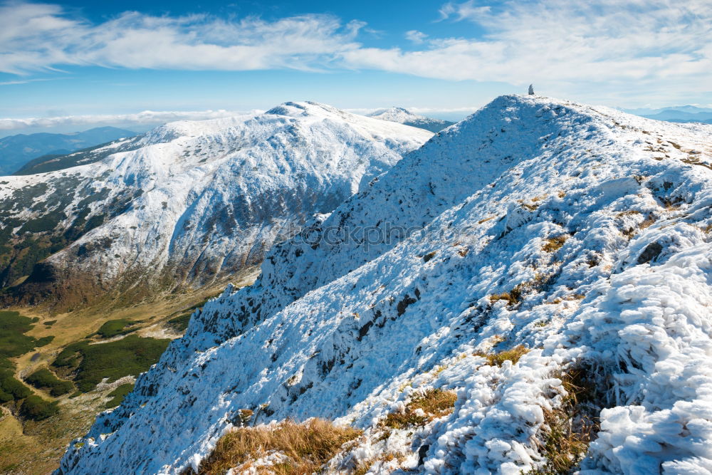 Similar – White peaks of mountains in snow