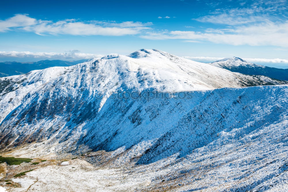 Similar – White peaks of mountains in snow