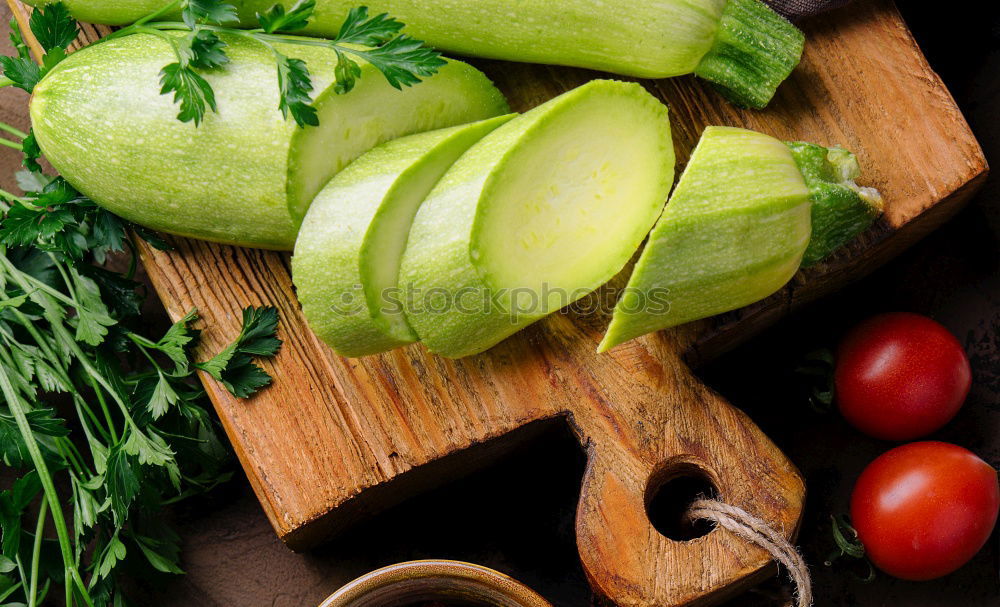 Similar – Vegetables and utensils on kitchen table