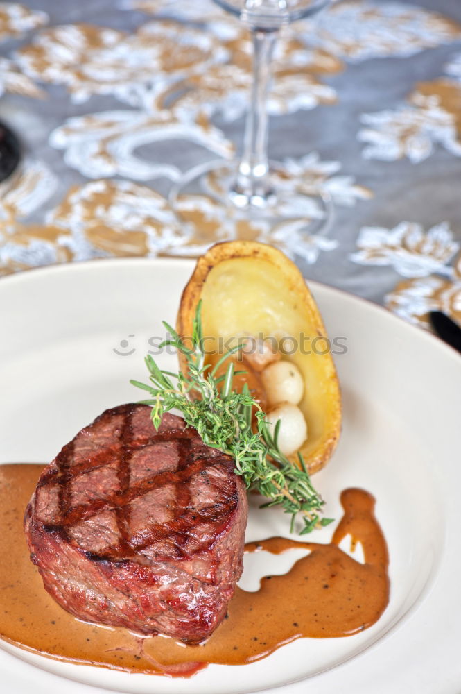 Similar – dinner with beef on a pure white dinner plate