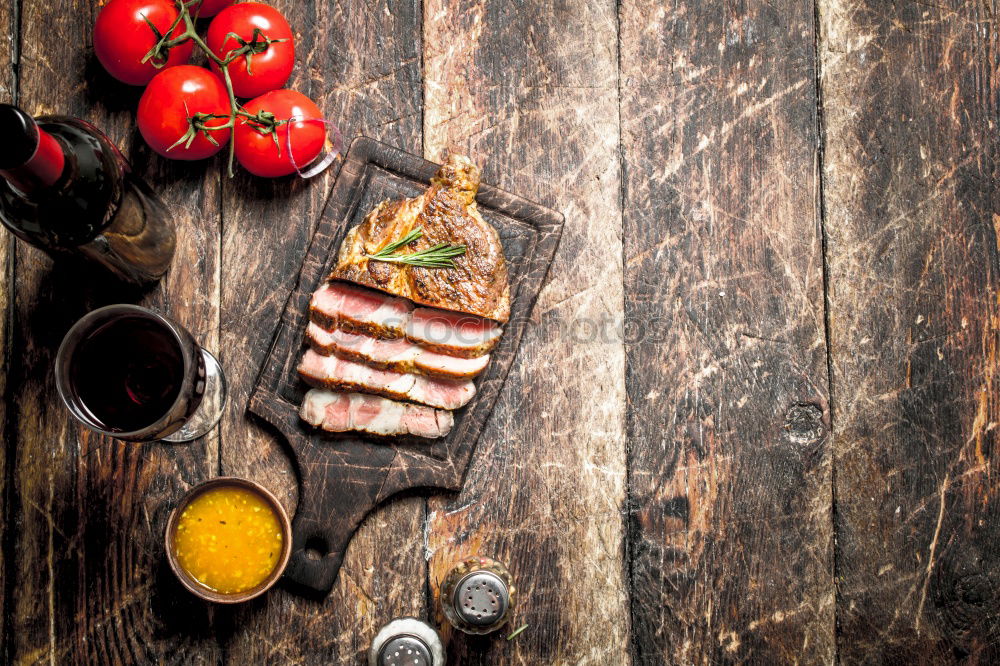 Similar – Image, Stock Photo Sliced grill steak on cutting board with wine and spices