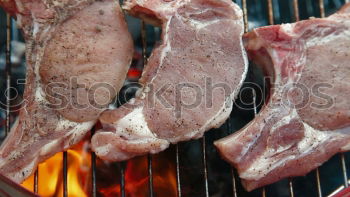 Similar – Image, Stock Photo Juicy steaks on the charcoal grill