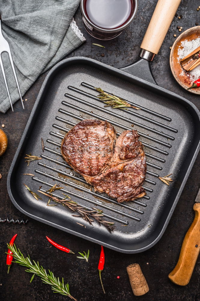 Image, Stock Photo Ribeye steak on grill iron pan