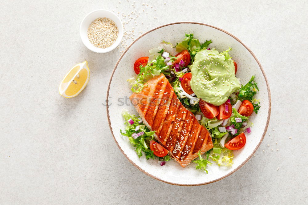 Similar – Fry salmon fillet with dill, lemon, oil and tomatoes