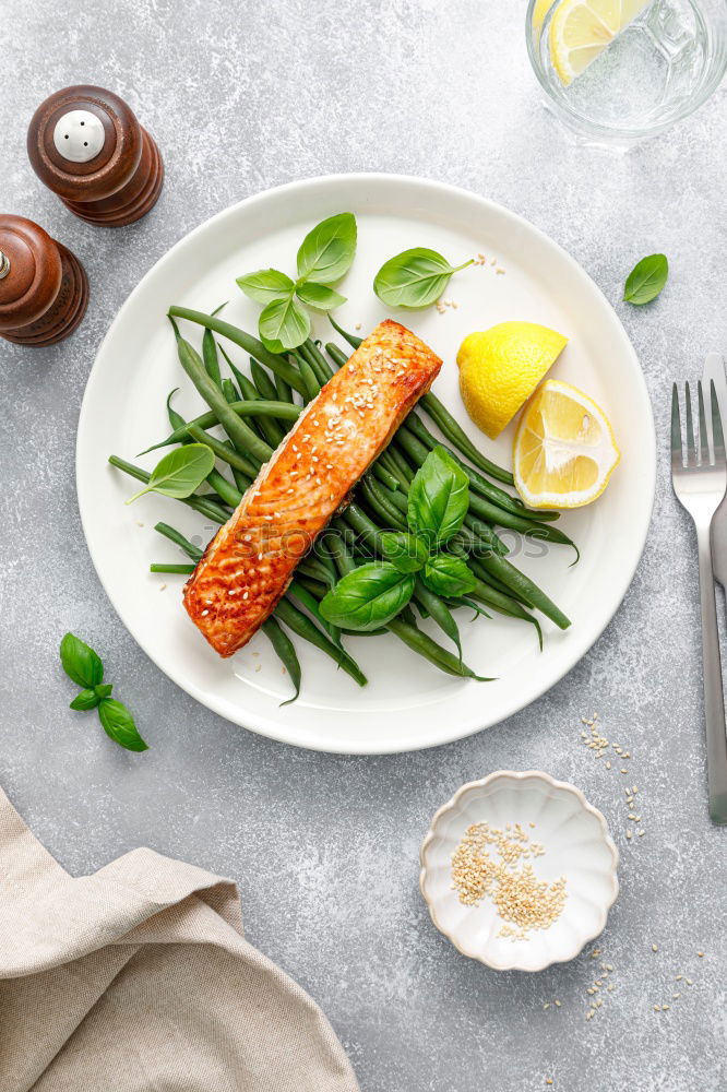 Similar – Salmon with spinach on a white kitchen table