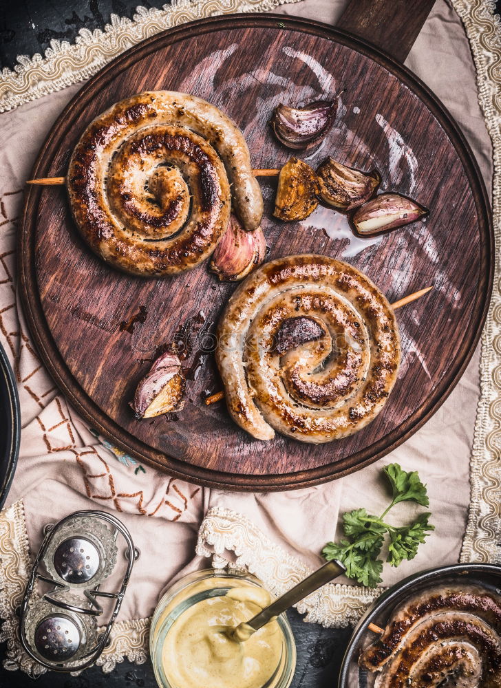 Similar – Bratwurst with potatoes and sauerkraut