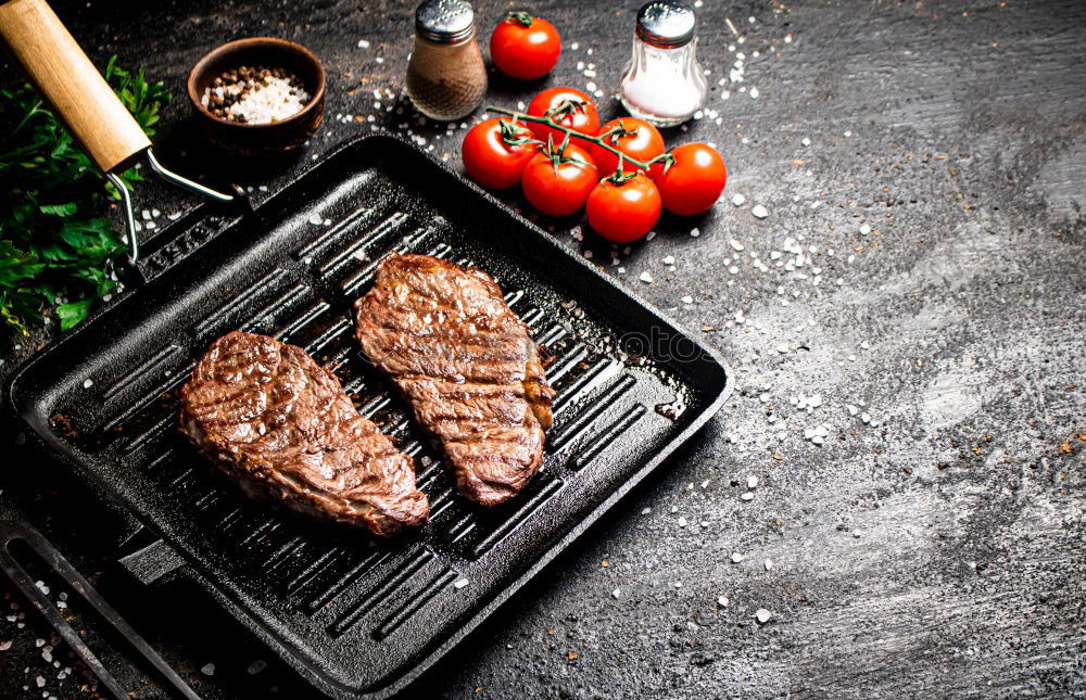 Similar – Image, Stock Photo Ribeye steak on grill iron pan