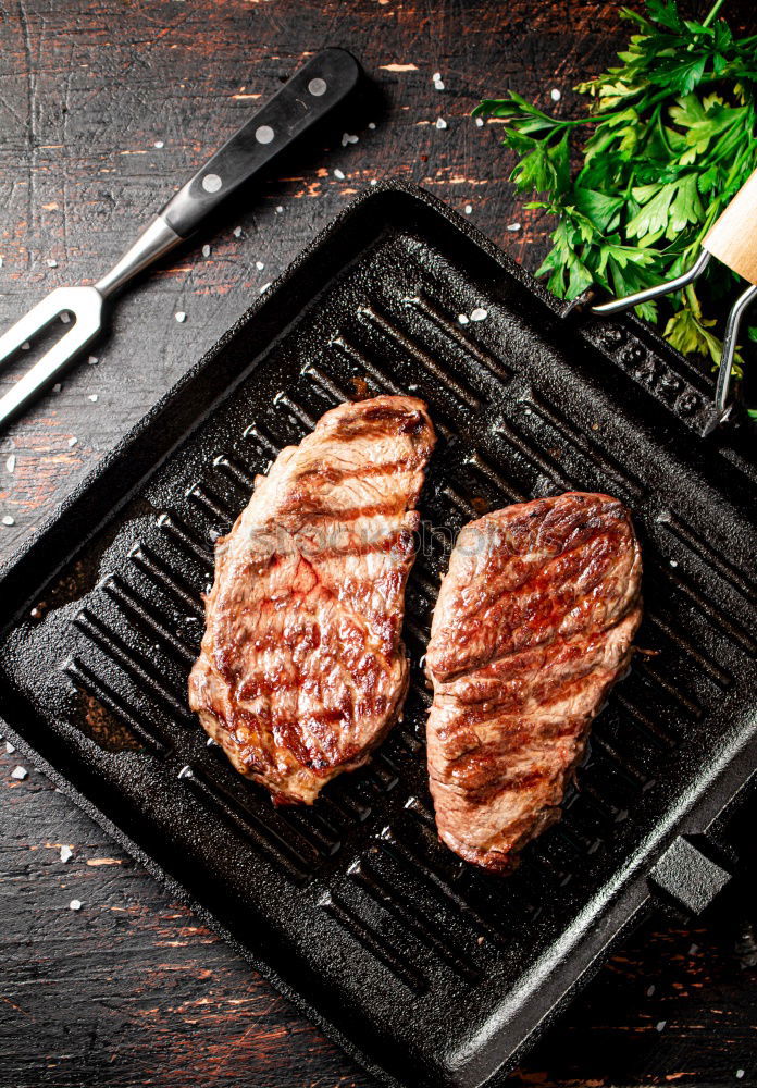 Similar – Image, Stock Photo Ribeye steak on grill iron pan