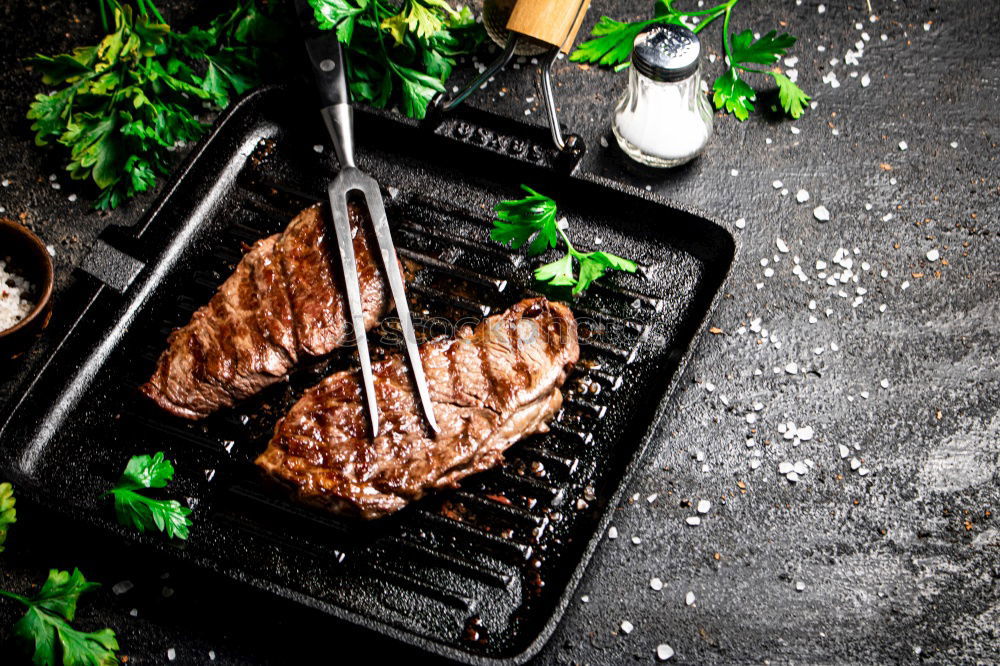 Similar – Image, Stock Photo Ribeye steak on grill iron pan