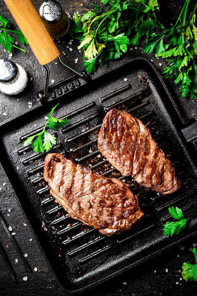 Similar – Image, Stock Photo Ribeye steak on grill iron pan