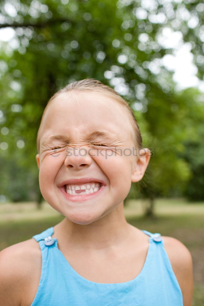 Similar – girl child tongue meadow