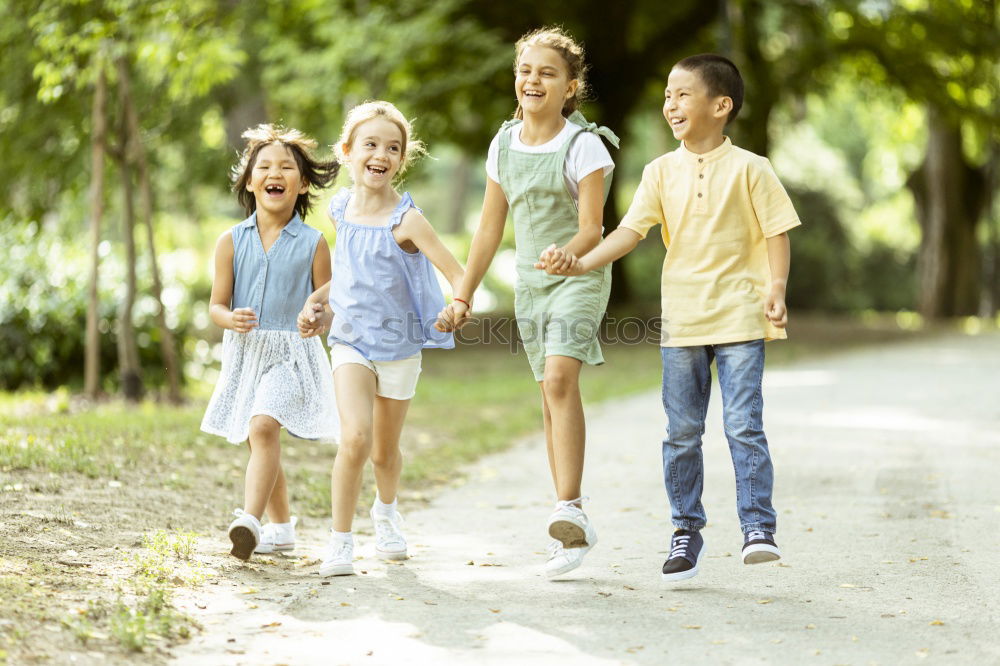 Similar – Children have fun running in nature