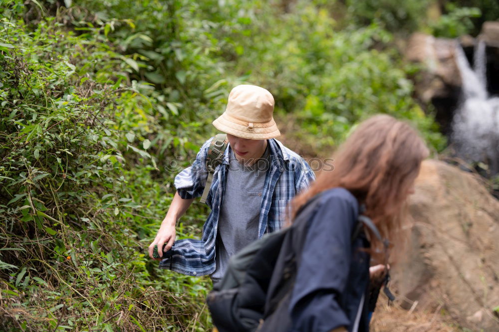 Similar – Image, Stock Photo Couple pausing while doing trekking