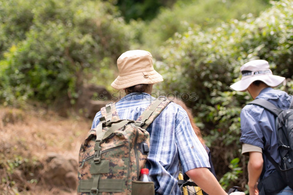 Similar – Image, Stock Photo Couple pausing while doing trekking