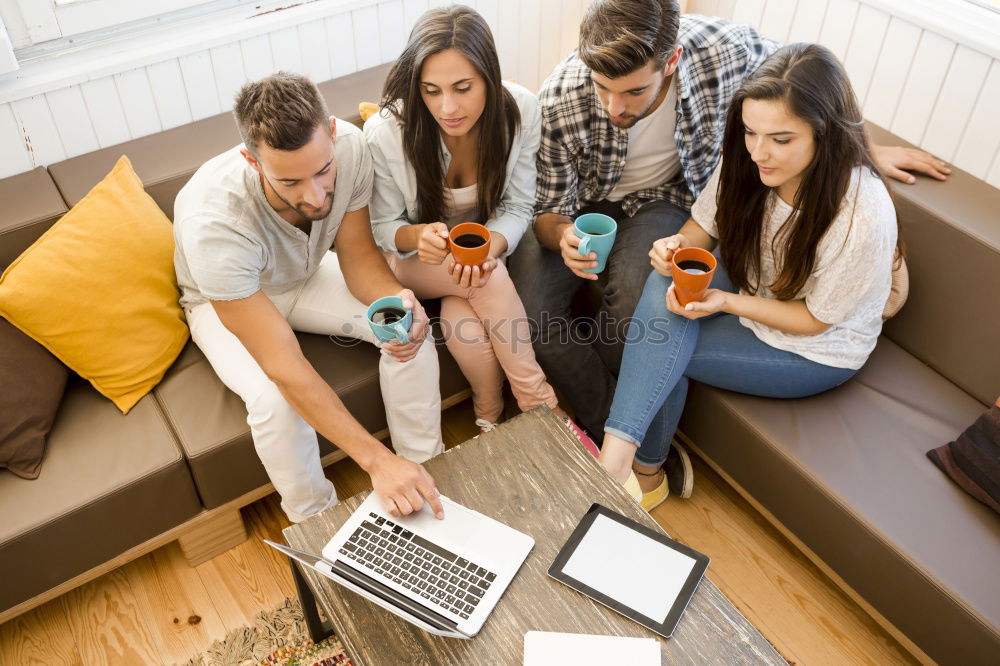 Similar – Happy family at home in the couch playing classic table games