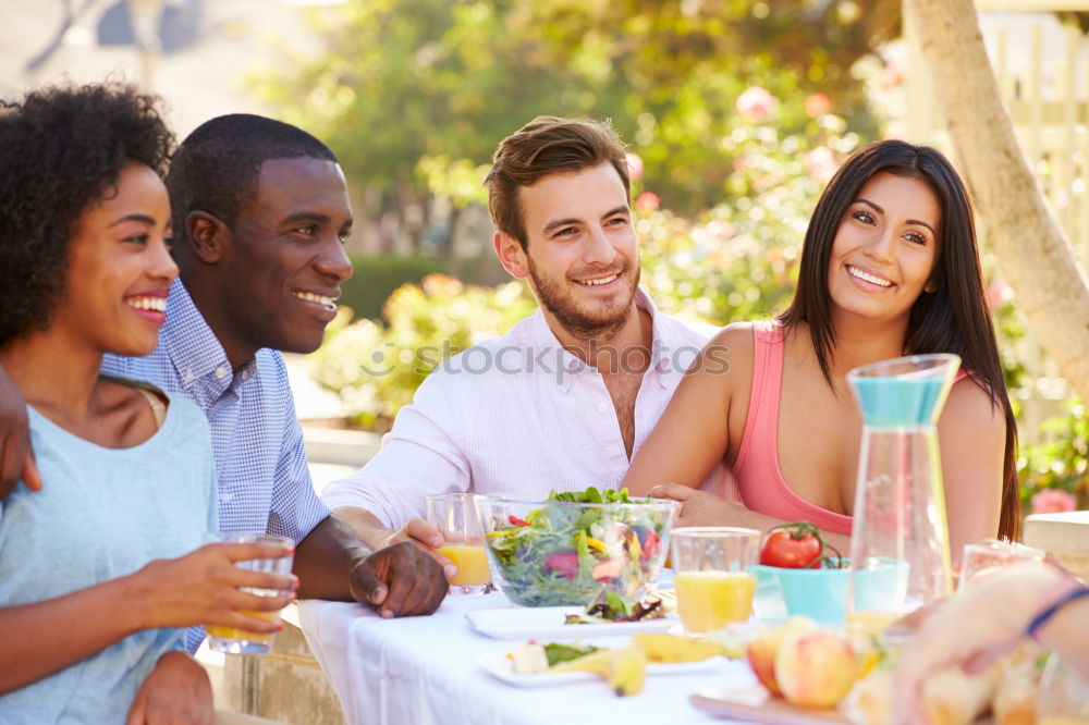 Similar – Cute mixed race couple enjoying wine together on date