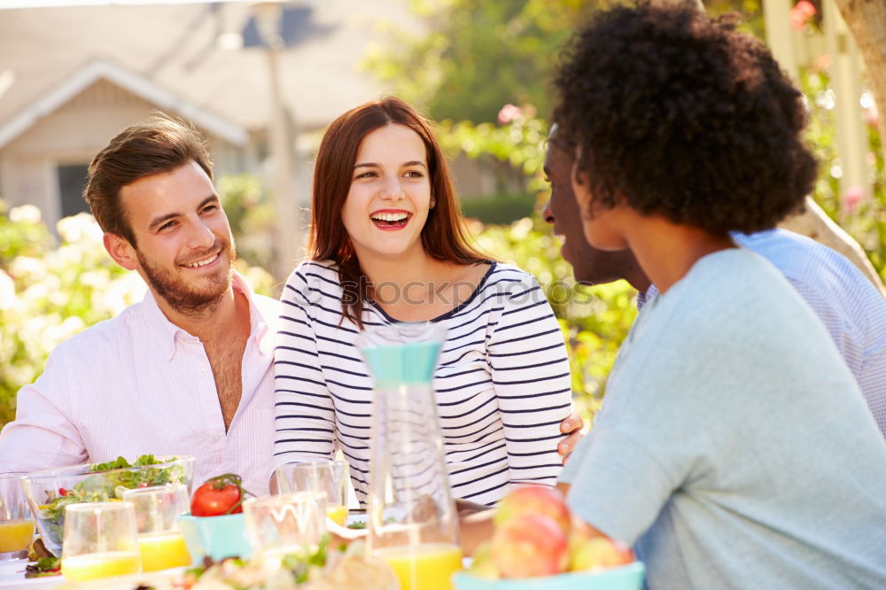 Similar – Cute young adult couple taking photo at outdoor picnic