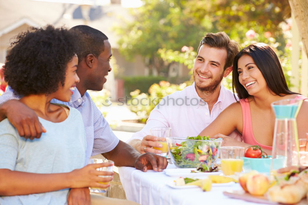 Similar – Cute mixed race couple enjoying wine together on date