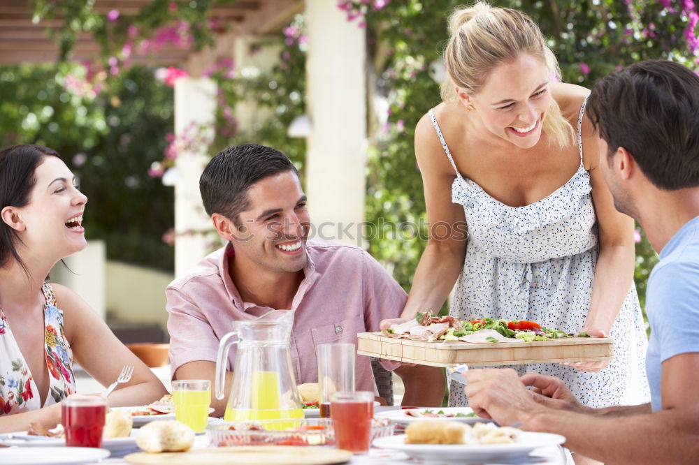 Similar – Cute young adult couple taking photo at outdoor picnic