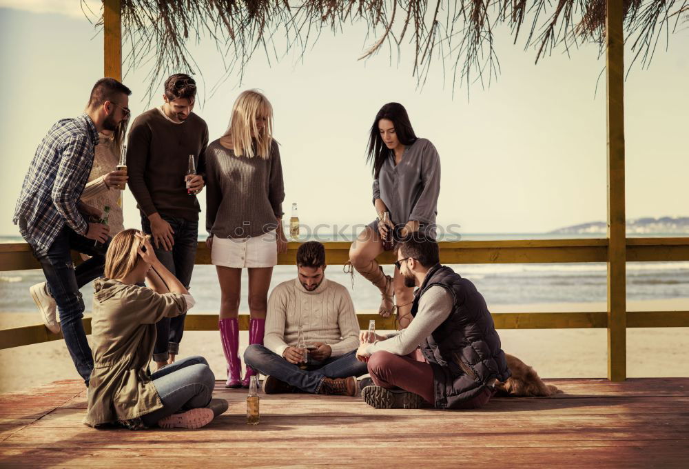 Similar – Image, Stock Photo Group of friends hanging out at beach in summer